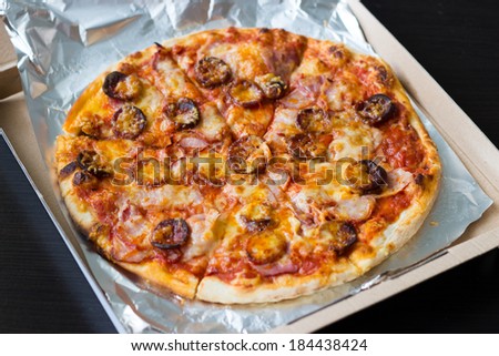 Sausages and bacon pizza