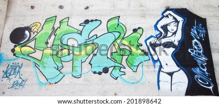 SLOVAKIA, RUZOMBEROK - JUNE 28 2014: Woman graffiti on a legal wall in public skatepark