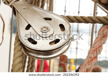 Closeup of old metal block and rigging at the yacht