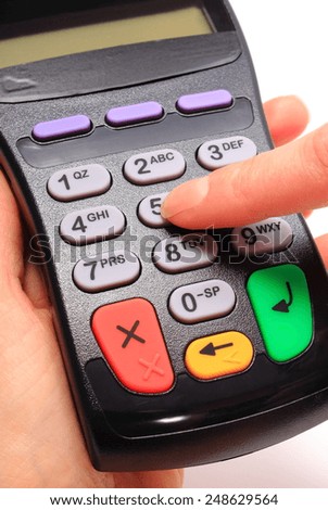Hand of woman using payment terminal, enter personal identification number, finance concept
