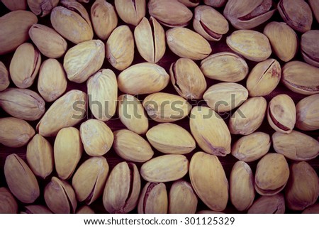 Vintage photo, Roasted pistachio nuts as background, healthy food and nutrition