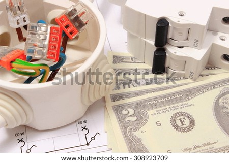 Copper wire connections in electrical box, electric fuse and money on construction drawing of house, concept for engineering and energy savings