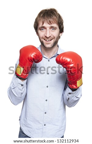Man wearing boxing gloves smiling on white background