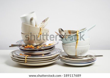 Dirty dishes pile needing washing up. Household chore concept on white background Stock foto © 