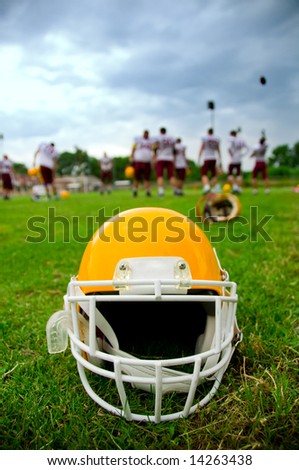 American football helmet in grass