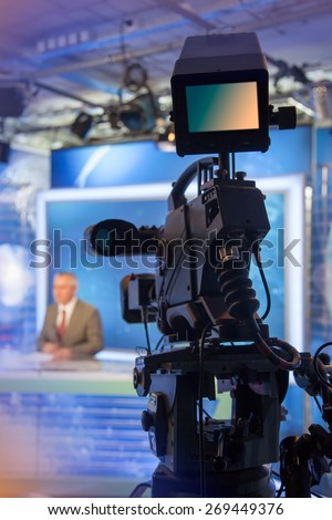 Video camera - recording in TV NEWS studio - Talking To The Camera