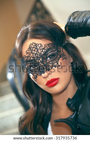 Attractive women with black lace mask. Shallow depth of field. Selective focus.