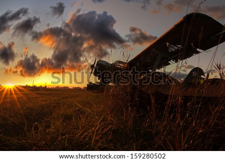 old plane on a sunset background