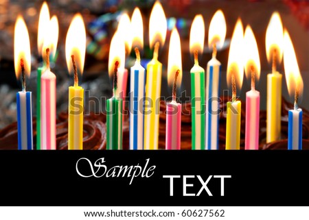 Birthday candles on chocolate cake with copy space.  Macro with shallow dof.