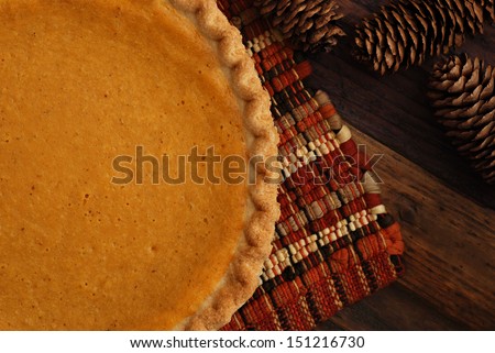 Similar – Image, Stock Photo Pumpkin pie home-baked, above view. Sliced pie isolated on a colorful background