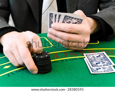 hands of men who makes a bet at the casino