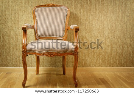 Single Old Antique Armchair Near The Wall