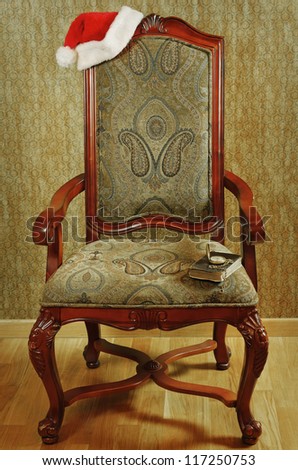 Old Antiques Armchair With Santa\'s Hat And Book