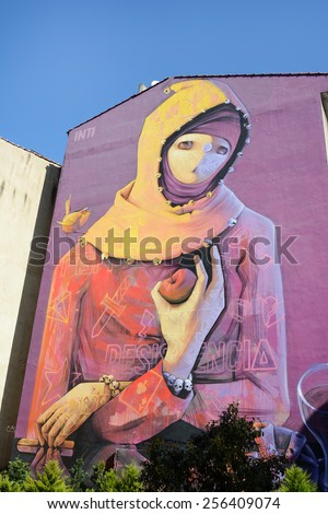 ISTANBUL,TURKEY, FEBRUARY 21, 2015: Side wall of an apartment painted with a woman figure in Yeldegirmeni, Kadikoy in Istanbul, Turkey.