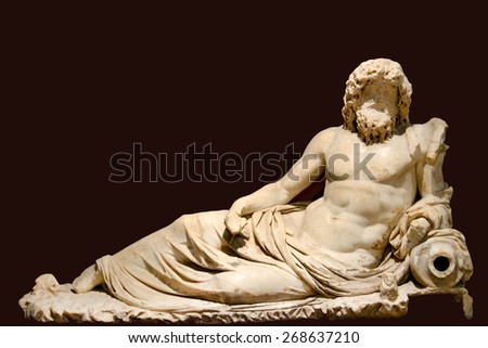 ISTANBUL, TURKEY, DECEMBER 6, 2013: The Statue of Oceanus at Istanbul Archeology Museum, brought from Ephesus, dated to the 2nd century AD depicts the River God Oceanus while he lies on rocky ground.