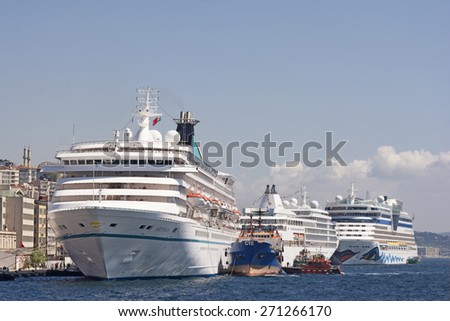 ISTANBUL, TURKEY, APRIL 21, 2014: Touristic cruise ships docked on Karakoy Port, Karakoy is today a major transport hub for intercity and international passenger traffic.