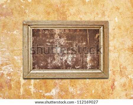 Blank photo frames on the grunge background