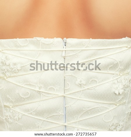 brides back in wedding white dress with lace