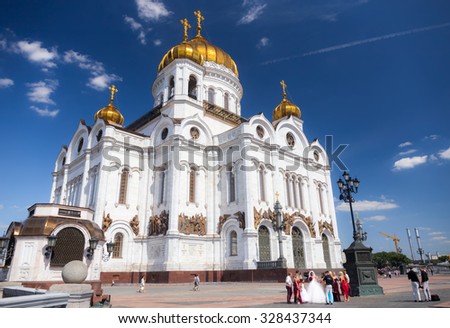 MOSCOW - JULY 25: People walking near Cathedral of Christ the Savior on July 25, 2015 in Moscow. Cathedral of Christ the Saviour with an overall height of 103 metres.
