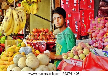 SRINAGAR, INDIA - JUNE 23, 2012 : Fruit merchant on local market, Srinagar, India.