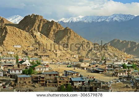 Small village in the valley with snow mountain at background, Leh, state of Jammu and kashmir, India