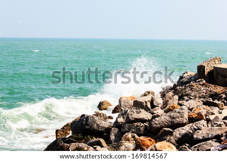 The Huge waves crashing on the rocks