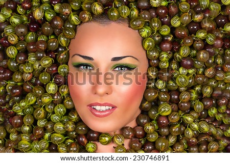 Beautiful female face in gooseberry