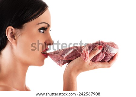 hungry woman eating raw meat