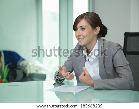 Happy young business woman in meeting