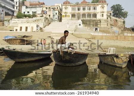 VARANASI, INDIA - APRIL 30: Unidentified Indian man goes fishing in the Ganges River on April 30, 2009 in Varanasi, India. For most of Varanasi\'s dwellers fish is important source of livelihood.