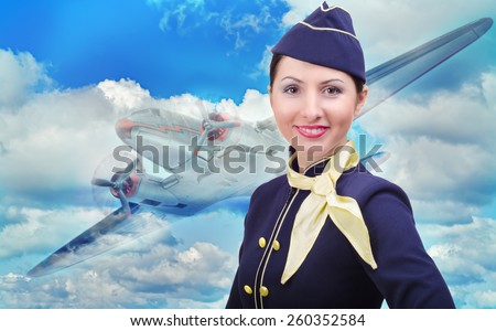 Portrait of beautiful smiling stewardess on a background of an airplane flying in the sky