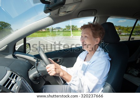 Elderly women who are driving a car