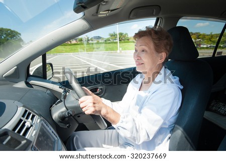 Elderly women who are driving a car