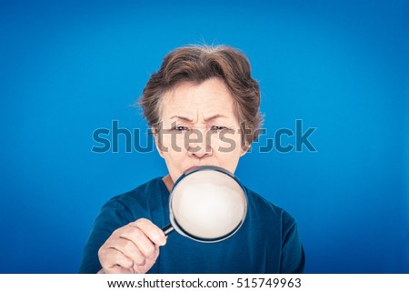 Similar – Image, Stock Photo Senior woman with magnifying glass