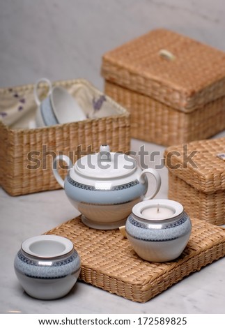 tea set in wicker boxes