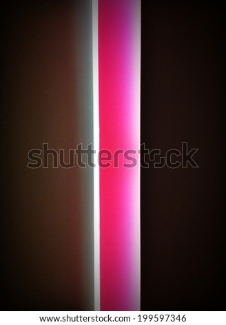 A glowing pink light behind a door with an Instagram effect filter.