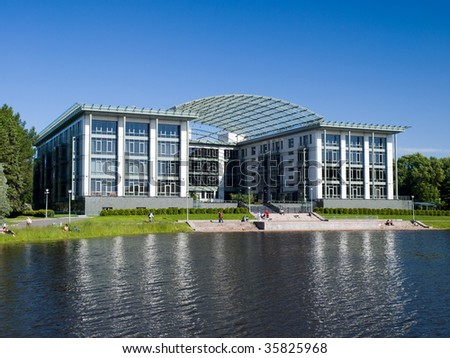 Modern building on the quay of small lake