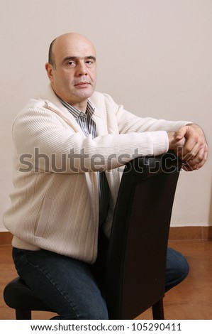 The man sitting on the chair