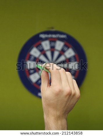 human hand with dart closeup