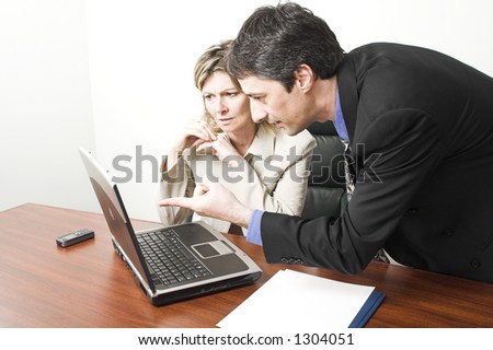 business people in meeting with laptop