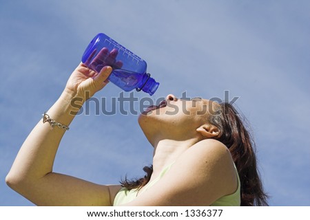 girl drinking water close up