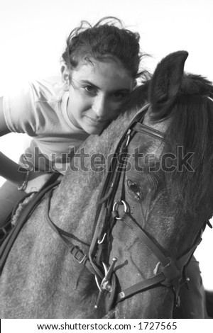 girl riding a horse in black and white