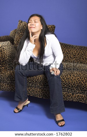 woman thinking on couch