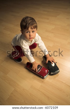 Image, Stock Photo Toddler seated on laminate floor; feet touch each other as legs splay out in open seated pose similar to butterfly pose in yoga