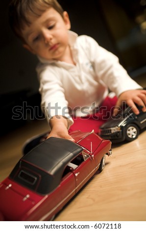 Similar – Image, Stock Photo Toddler seated on laminate floor; feet touch each other as legs splay out in open seated pose similar to butterfly pose in yoga