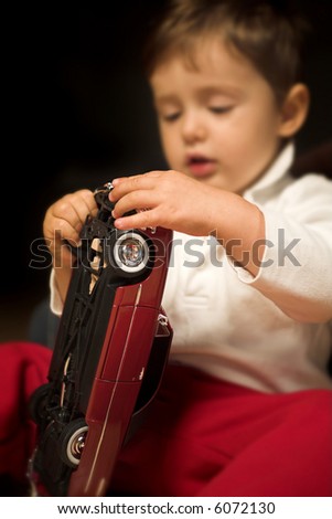 Similar – Image, Stock Photo Toddler seated on laminate floor; feet touch each other as legs splay out in open seated pose similar to butterfly pose in yoga