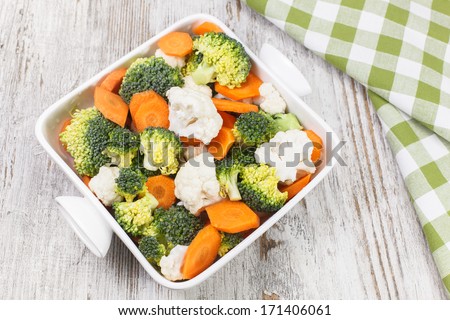 Vegetable Salad. Raw vegetable salad greens made from broccoli, cauliflower and carrots. Raw food. diet. Vegetarian. Macrobiotic. Copy space composition