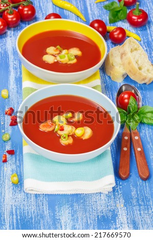 Creamy Tomato Soup. Two bowls of delicious tomato soup. Macro, selective focus.