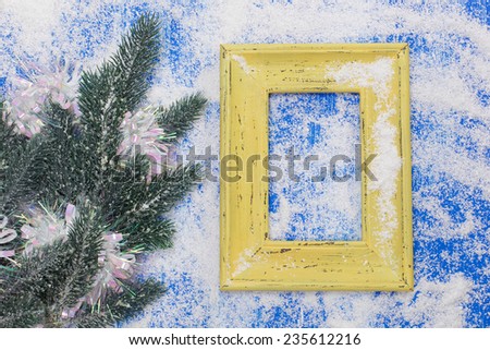 Blank photo frame and Christmas decoration. Vintage frame and Christmas decoration on old rusty background.  Copy space for your text.