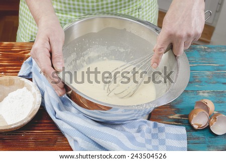 Similar – Image, Stock Photo Faceless woman preparing eggs with whisk in kitchen